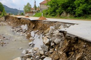 Side of a road falling into a river