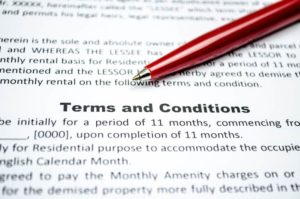 Pen on a paper with terms and conditions