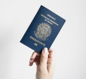 Hand holding a passport