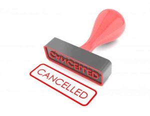 Stamp laying down with the word "cancelled" stamped in red
