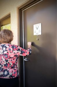 saleswoman knocking on door