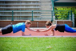 Man and woman on a track working out