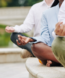 Picture of people meditating.