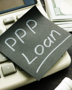 Picture of sticky note with PPP Loan written on it.
