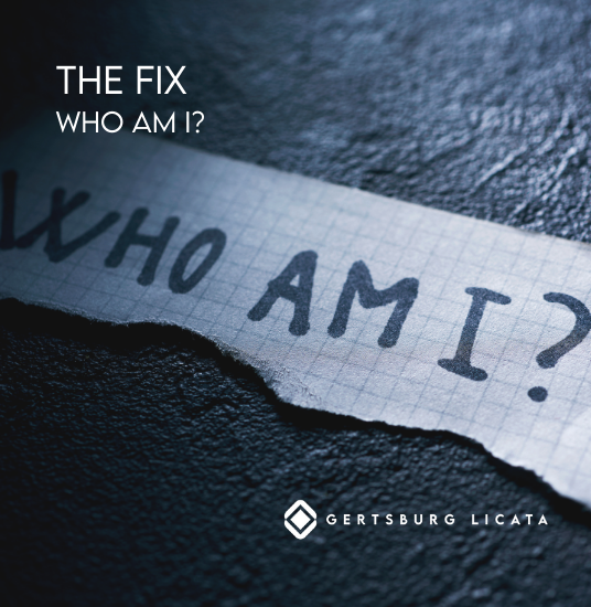 Picture of a piece of paper that reads "Who am I?"