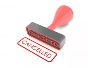Stamp laying down with the word "cancelled" stamped in red